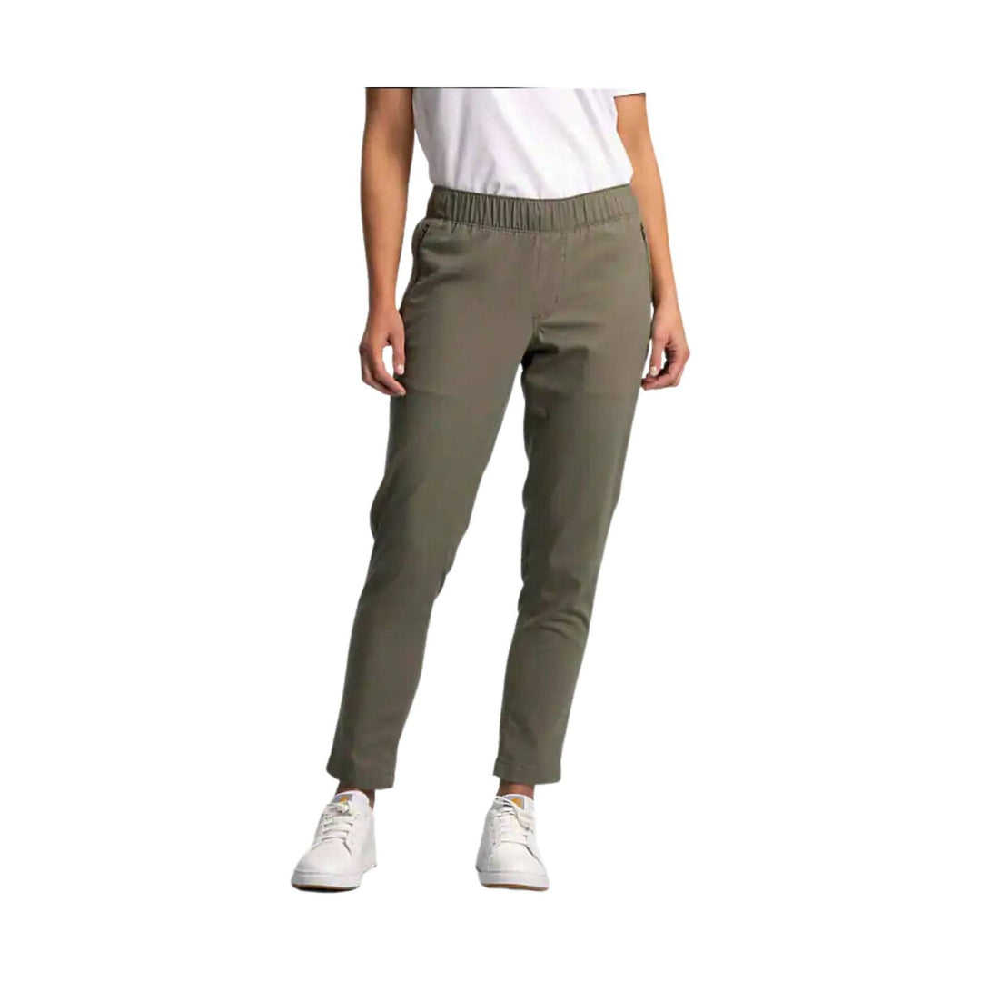 Olive straight-leg work pants with an elastic waistband, shown on a model with white sneakers