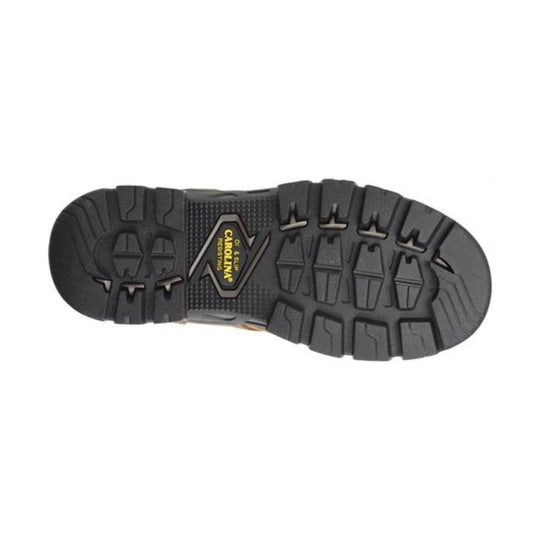 Close-up of a black boot sole with a brand logo on a white background