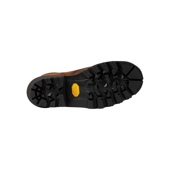 Boot outsole with deep black lug tread and a yellow Vibram logo