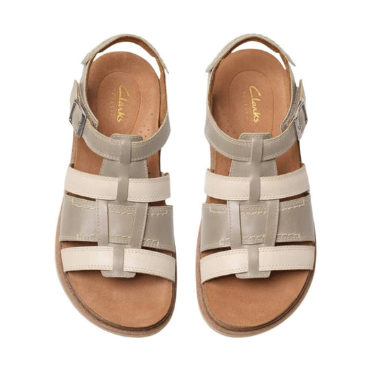 Beige leather sandal with ankle strap, side buckle, and crisscross front straps, shown from above