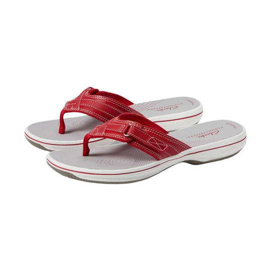 Red thong sandals with white cushioned soles and a toe post strap