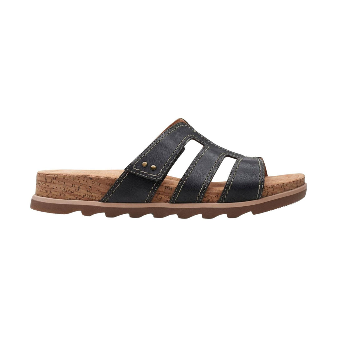 Black leather slide sandal with cork wedge sole and cutout strap design