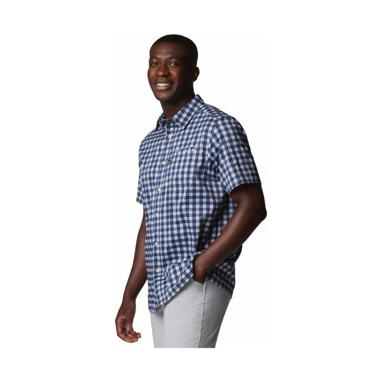 Blue plaid short-sleeve button-up shirt on a male model with light gray pants