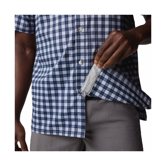 Blue and white plaid short-sleeve camp shirt with button front, worn open over gray shorts