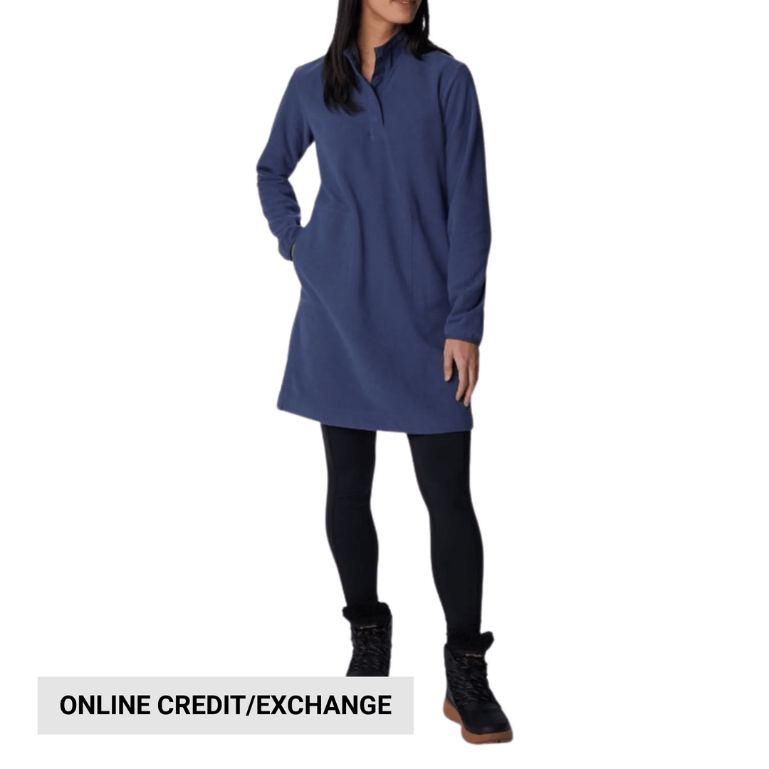 Woman wearing a blue long-sleeve fleece dress with a short stand collar, black leggings, and black boots; text reads ONLINE CREDIT/EXCHANGE