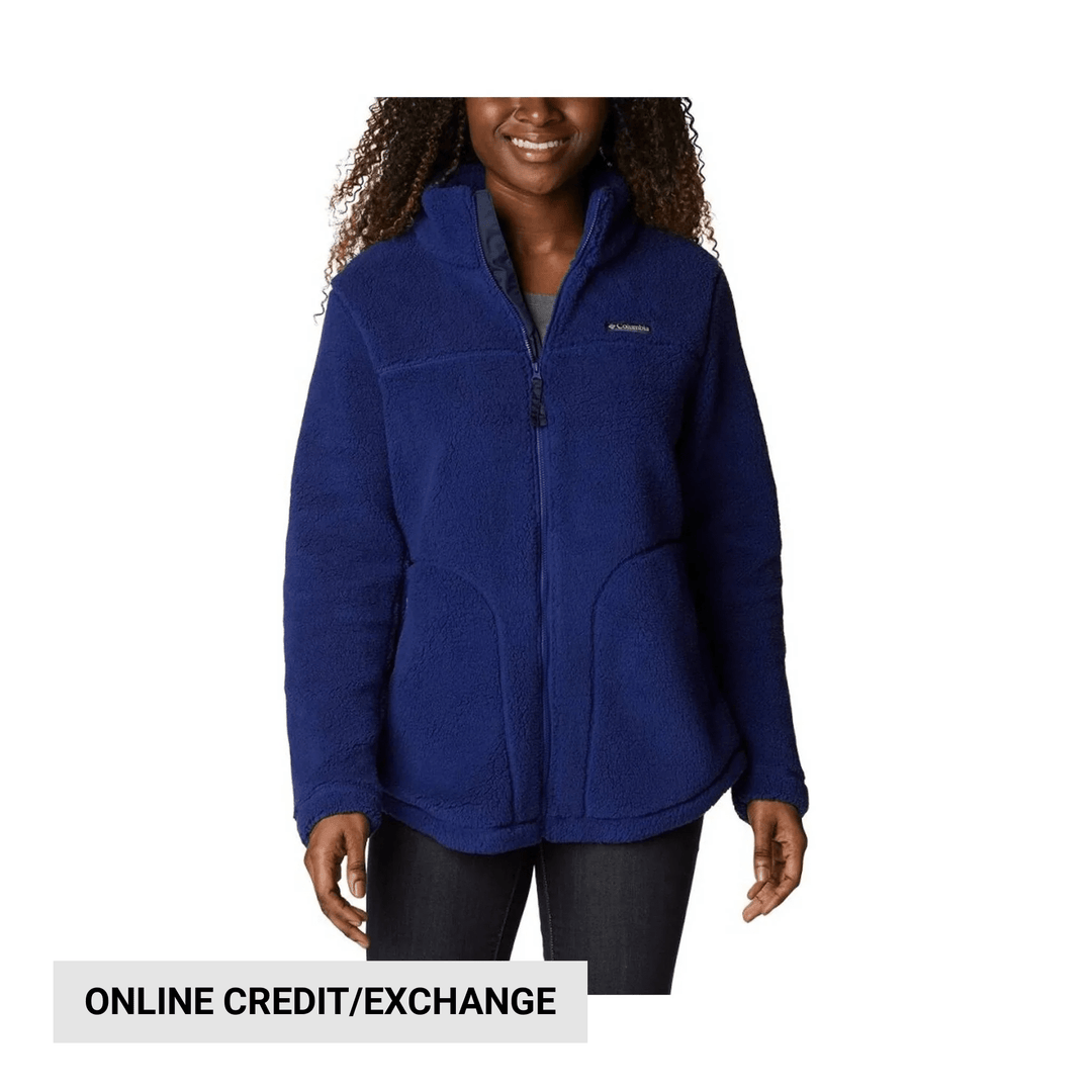 Woman wearing a blue full-zip fleece jacket with a stand collar and zippered front pockets