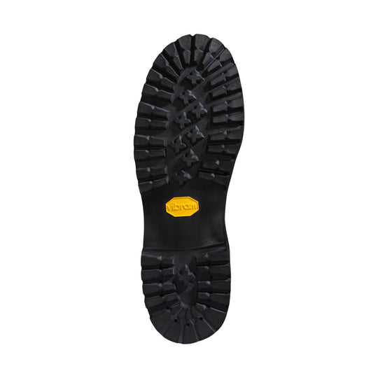 Black rugged boot outsole with deep tread and yellow Vibram badge