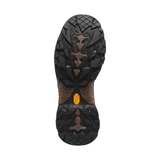 Black and brown boot outsole with rugged tread and a yellow Vibram insert