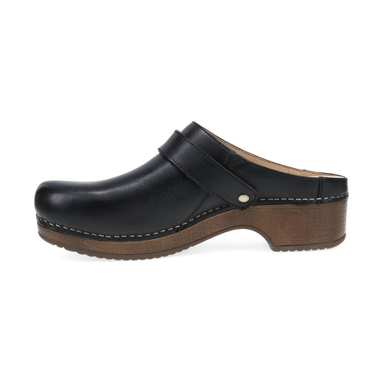 Black leather mule clog with a wood-look platform sole and closed toe, side view