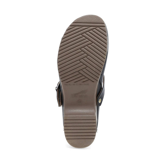 Brown shoe outsole with herringbone tread pattern and Dansko branding