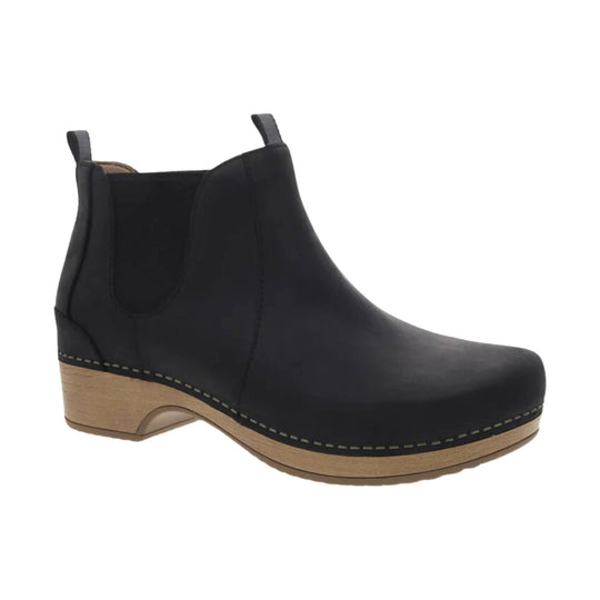 Black ankle boot with pull tabs and a tan wooden-look wedge sole