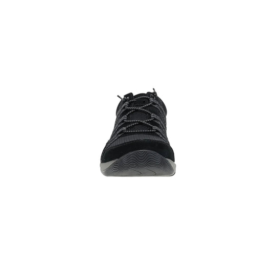 Black athletic shoe shown from the front with gray wavy outsole and bungee laces
