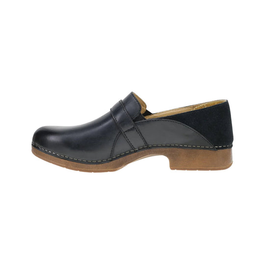 Black closed-toe clog with a wood-toned sole, side cutout, and low heel in side profile
