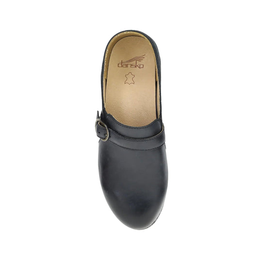 Black leather clog with a buckle strap and tan insole