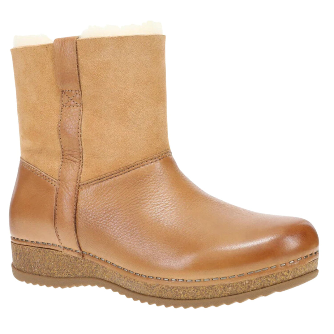 Tan pull-on ankle boot with a smooth toe, suede shaft, and cork wedge sole