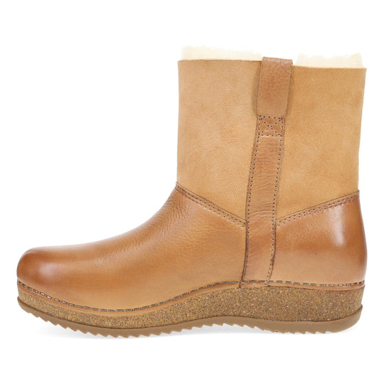 Tan mid-calf pull-on boot with shearling trim and cork platform sole