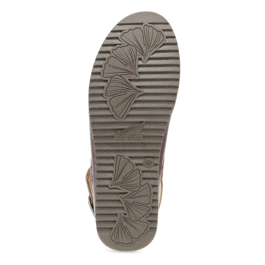 Taupe shoe outsole with ribbed tread, ginkgo leaf patterns, Dansko logo, and size 38 marking