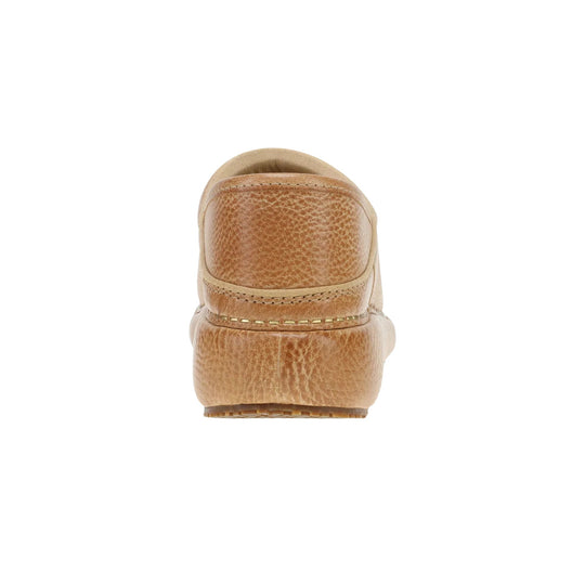 Tan distressed leather clog seen from the back with thick platform sole