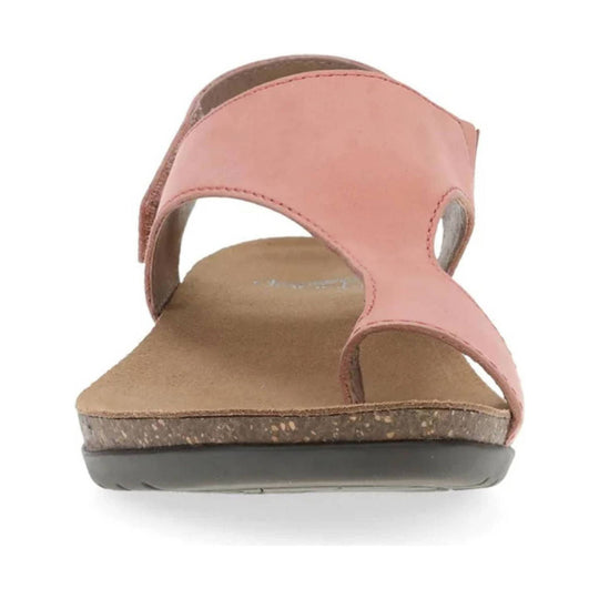 Pink slip-on sandal with wide upper strap, toe opening, and cork-look sole