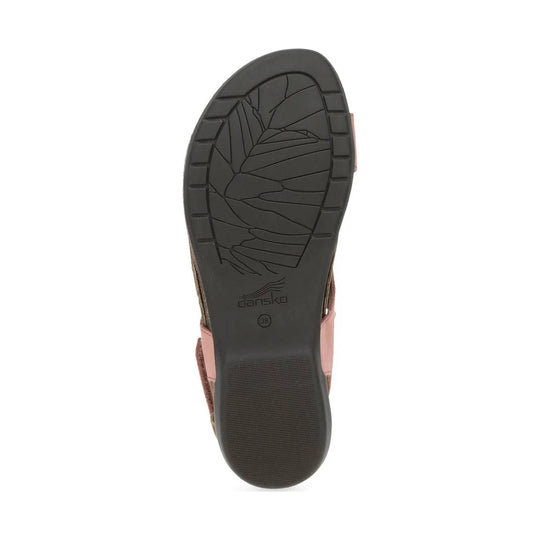 Black sandal outsole with tread pattern and Dansko logo