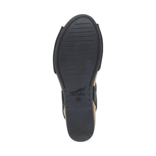 Black sandal outsole with a rounded toe, stitched edge, and textured tread
