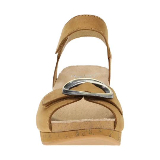 Tan open-toe wedge sandal with ankle strap and large silver ring detail