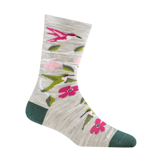 Light gray crew sock with pink and green hummingbirds and flowers, with dark green heel and toe