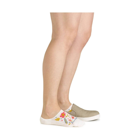Low-profile white no-show sock with colorful floral print and beige slip-on shoe