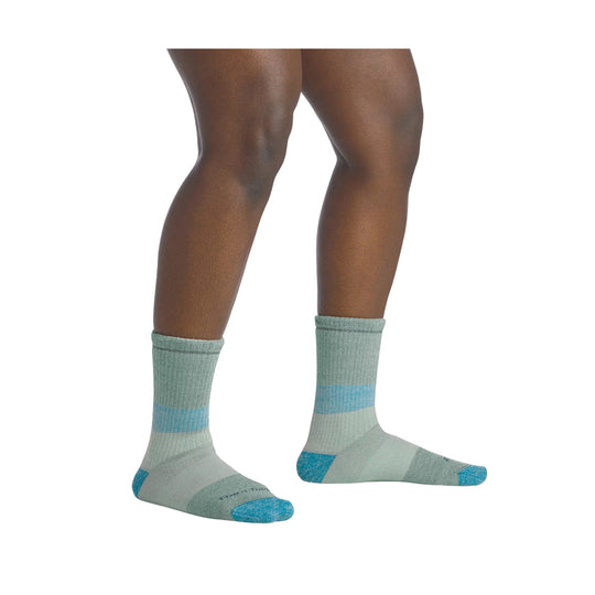 Light gray crew socks with teal toe and heel accents, shown on a model's lower legs