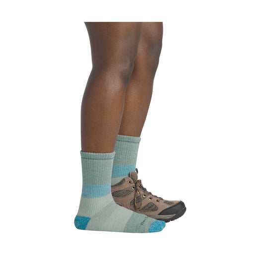 Light green ribbed crew hiking socks with blue accents, shown with brown hiking shoes on lower legs
