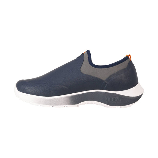 Navy slip-on shoe with gray side panels, a white midsole, and an orange heel loop