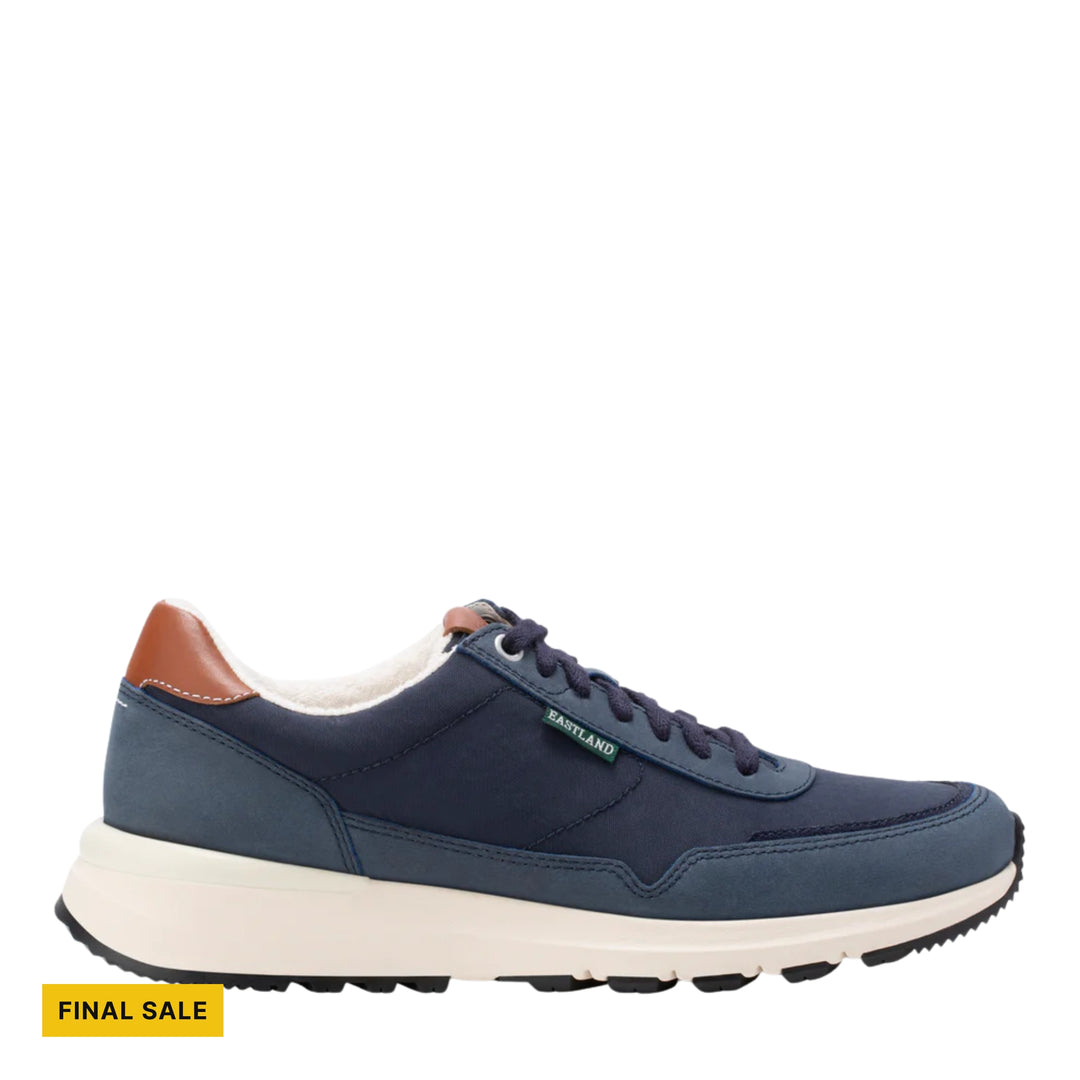 Navy low-top sneaker with white sole, tan heel tab, and FINAL SALE tag
