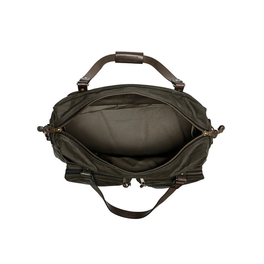 Dark canvas duffel bag with leather handles, open zipper, and detachable shoulder strap