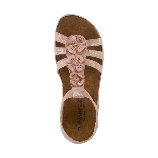 Pink slingback sandal with floral cutout straps and a cushioned cork footbed