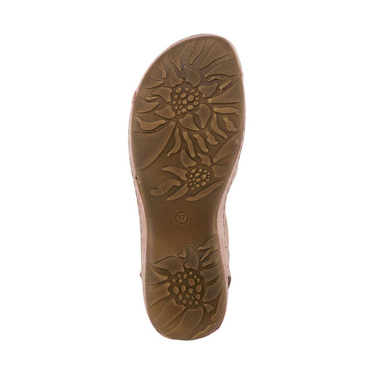 Light-colored slingback sandal with open toe and low wedge heel