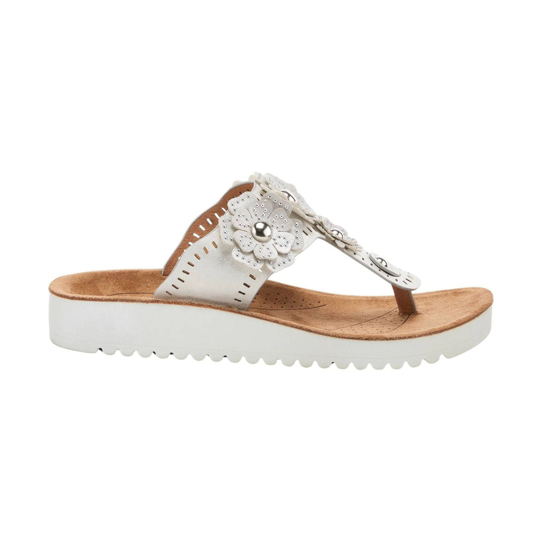 White wedge thong sandal with floral embellishments and a tan footbed