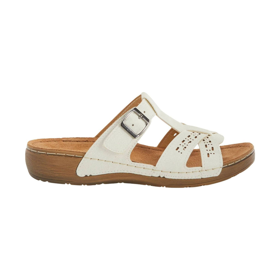 White slip-on sandal with cutout straps, buckle detail, and tan cork-look platform sole