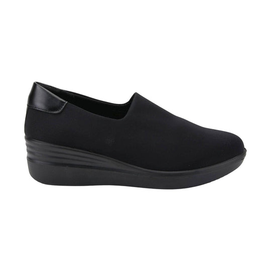 Black slip-on wedge sneaker with a smooth upper and textured platform sole