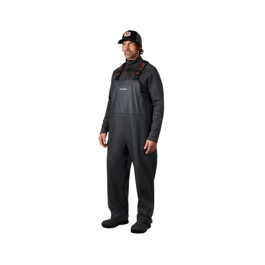 Black insulated bib overalls with shoulder straps, worn over a dark long-sleeve top and cap