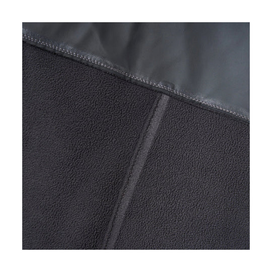 Close-up of dark fleece bib with waterproof top panel and stitched seam