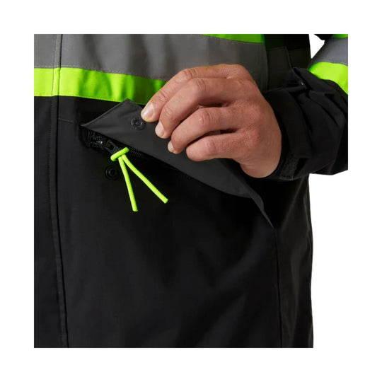 Black hi-vis waterproof shell jacket with neon yellow reflective chest stripe and zippered chest pocket