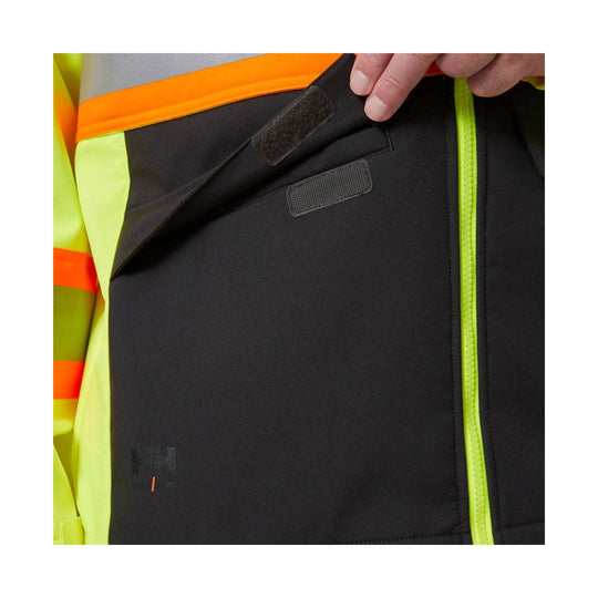 High-visibility black jacket with neon yellow and orange trim, zippered front, and Velcro chest flap
