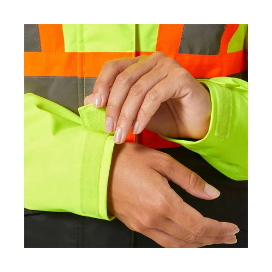 Hi-vis yellow jacket sleeve with hand fastening a cuff tab