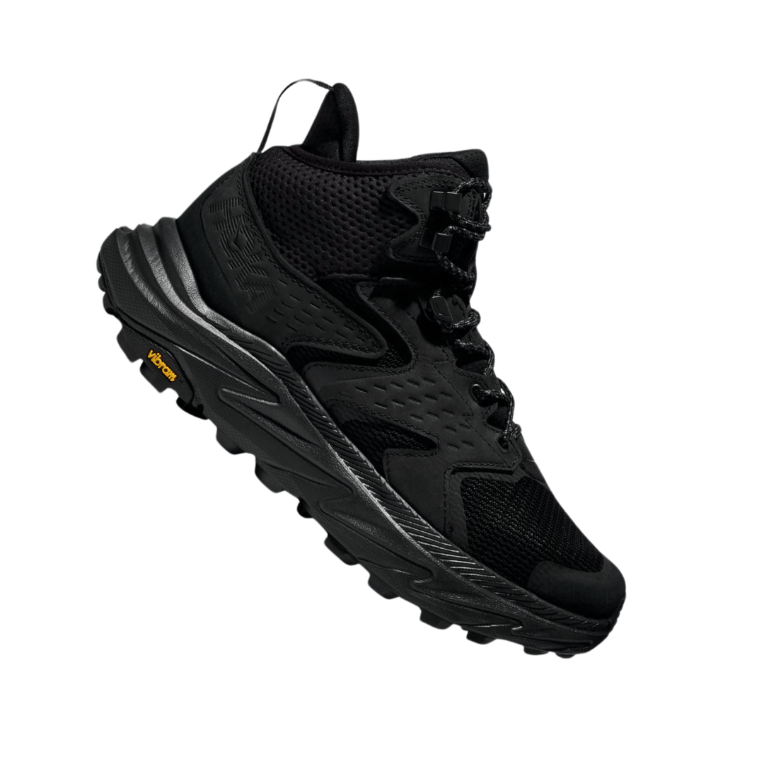 Black mid-top hiking boot with mesh panels, bungee laces, and a Vibram outsole