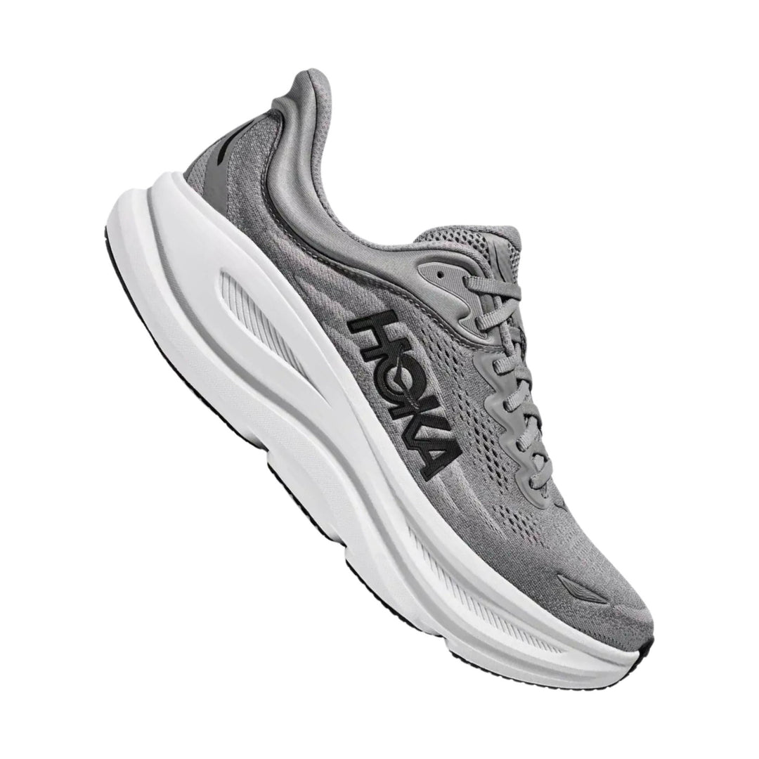 Gray athletic running shoe with white cushioned sole and black side logo