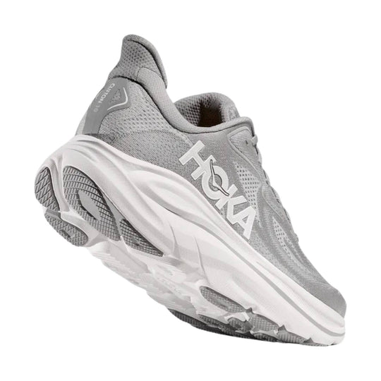 Grey HOKA running shoe with white midsole and treaded outsole, shown in side view