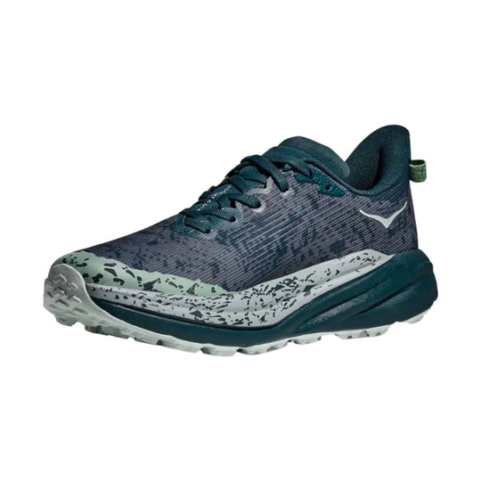 Dark teal trail running shoe with a speckled white midsole and lugged outsole, shown in side view.