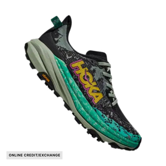 Black and teal trail running shoe with gray laces and a bold side logo, shown in side view, with ONLINE CREDIT/EXCHANGE text