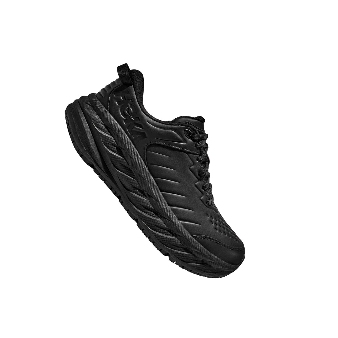 Black athletic walking shoe with thick cushioned sole, lace-up front, and side logo embossing