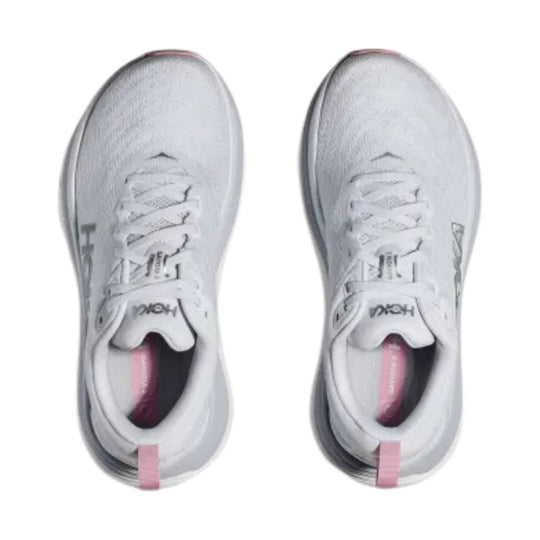 White athletic running shoes with pink heel tabs, shown from above